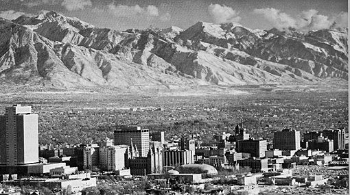 Near-horizontal aerial view of Salt Lake City and the Wasatch Front mountains east of the city.