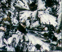 Color photomicrograph of melted fledspar from the Manicouagan crater in Quebec.