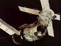 Color photograph of Skylab with solar panels extended.