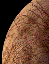 Color Voyager closeup image of Europa, showing a smooth surface with few markings.