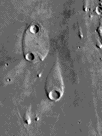 B/W image of a teardrop-shaped landform in Elysium Planitia on Mars considered to be a prime example of shaping by streamlining.